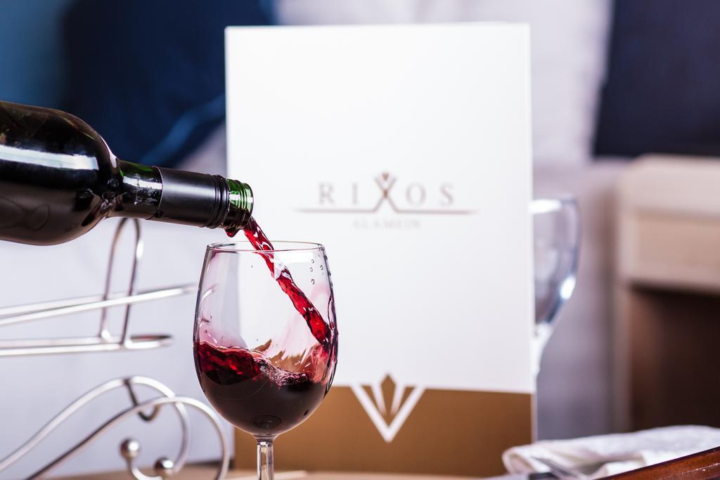 Rixos Alamein - Full Board Plus El-Alamein Eksteriør billede Wine being poured into a wine glass